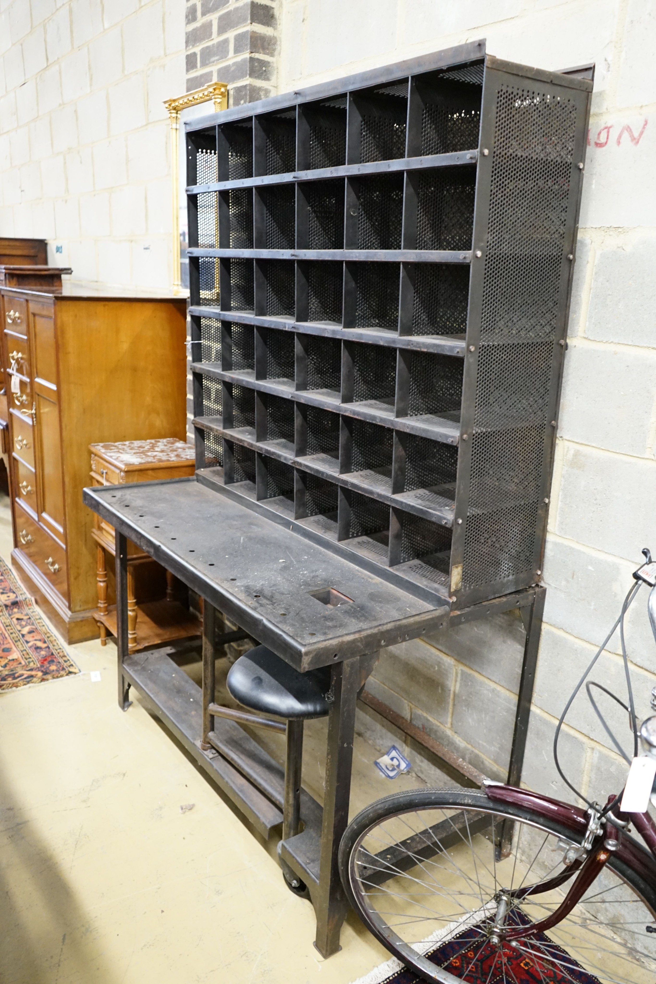 A Royal Mail metal mail sorting unit with integral seat, width 127cm, depth 71cm, height 190cm